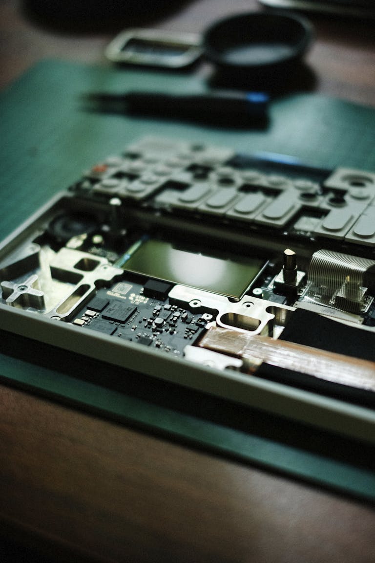 Close-up view of a laptop's internal motherboard components for repair or upgrade.
